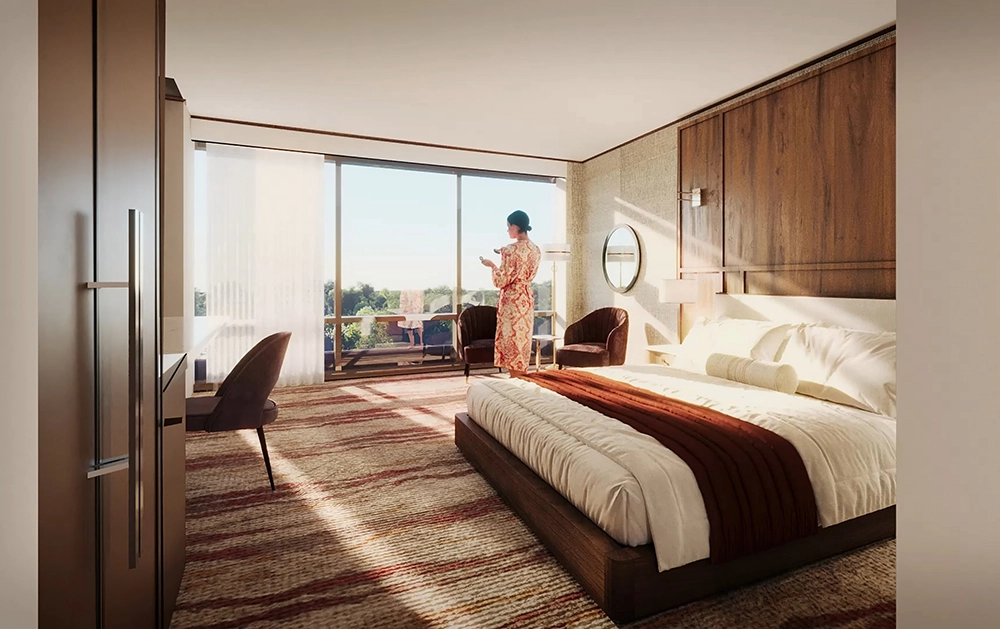 King-size bed, desk, and seating area in one of the suites at the Crescent Hotel. 